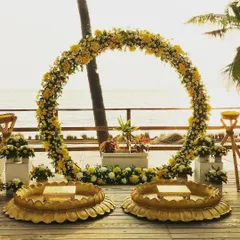 A beautiful Haldi ceremony setup right by the sea. I created this stunning floral ring arch and traditional 'urli' seating to blend perfectly with the natural beauty of the location, making for a truly memorable event.
