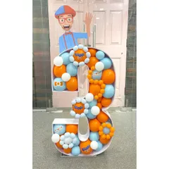 This number '3' mosaic for a Blippi-themed party shows how I can integrate a child's favorite character into a milestone display. The bright orange and blue colors, along with custom Blippi-themed details, make it a fun and recognizable centerpiece.