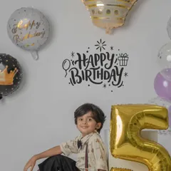 A relaxed portrait for a 5th birthday, using a giant number balloon and wall decals. My studio sessions can be customized with different props and backdrops.