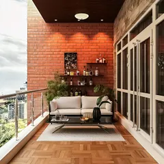 An entertainer's dream, this balcony combines an industrial-style brick wall with a sleek, modern bar setup. A comfortable white sofa and parquet-style wood flooring complete this stylish space for hosting guests.