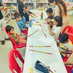 A wide view of the workshop where kids are assembling their own lightning dandiyas. This project combines creativity with basic electronics.