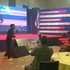 Engaging the audience from the stage during a corporate awards ceremony. My stage act is interactive, often bringing the magic off the stage and into the audience to create a more personal connection.