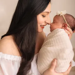 A mother and her newborn baby touching noses. These are the quiet, intimate moments I aim to capture during a newborn family session.