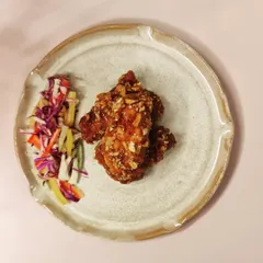 This simple, elegant plate with a raised edge is perfect for a romantic dinner setting. I can create entire dinnerware sets, including matching tumblers or carafes, to create a cohesive look for your establishment.
