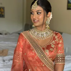 A close-up of this radiant bride. The makeup is blended seamlessly to honor her natural skin tone while adding a touch of bridal glam.
