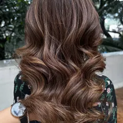 This is my signature 'Caramello' color. It features warm caramel highlights woven through a brunette base for a sweet, sun-kissed look.