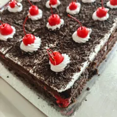 A timeless classic, our Black Forest pastry. Layers of chocolate sponge, fresh cream, and cherries are topped with chocolate shavings and a signature cherry.