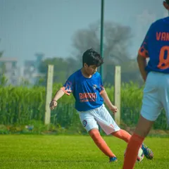 Meet Samarth Jain, a talented left footer with incredible vision. This image shows his focus as a midfield maestro, a skill he has honed over three years with us.