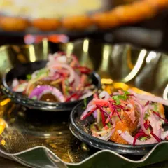 This is my Delhi-style Karari Aloo Tikki Chaat, served fresh. The crispy potato patty is loaded with zesty onions and spices, creating a dish that is irresistibly tangy and flavorful.