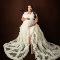 A powerful and confident pose in a stunning white ruffled gown. My studio sessions are designed to make you feel comfortable and beautiful, capturing your strength as you await your baby.