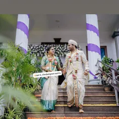 Walking together into their future. The couple looks stunning in their coordinated wedding outfits.