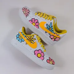 A floating shot of the Summer Bloom floral AF1s, showcasing the pastel flowers and bold outlines.
