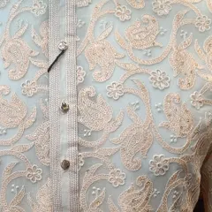 A closer look at the craftsmanship of my embroidered kurtas. The detailed threadwork and sequin accents on the placket and body elevate this simple garment into something special.
