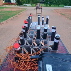 The organized chaos behind a professional pyrotechnic display. Every tube is carefully placed and wired to ensure a flawless and magical sky show.