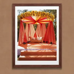 We transform your love story into a perfect celebration. This vibrant mandap, adorned with sunflowers and flowing drapes, exemplifies our bespoke wedding decor services, blending tradition with personalized elegance for your special day.