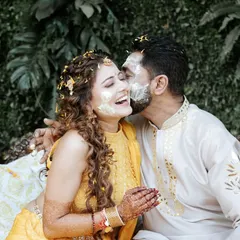A playful kiss and a smear of haldi. These are the candid, messy, and absolutely beautiful moments that make a Haldi ceremony so special.