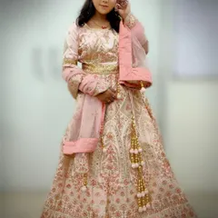 This full-length view showcases how our students learn to consider the entire bridal ensemble, ensuring the makeup and hair complement the lehenga and accessories for a cohesive and stunning appearance.