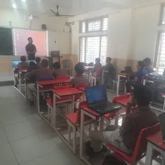 Students listen attentively during a cybersecurity workshop. We equip them with the knowledge to navigate the digital world safely and responsibly.