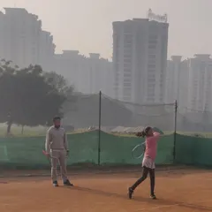 Observing the follow through of a forehand stroke. I provide real time feedback to help players refine their technique and build muscle memory for powerful, accurate shots.