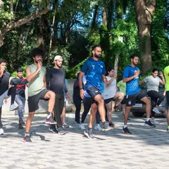 The team warming up together at a Saturday Surge. We start every session with dynamic movements to prepare the body for the work ahead.