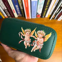 I've been fascinated with Renaissance art lately, so I painted this adorable pair of cherubs on a green jewelry case. It adds a classical and romantic touch to an everyday item.