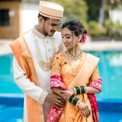 We specialize in capturing the beauty of Maharashtrian weddings. This portrait showcases the couple in traditional attire, highlighting the groom's Pheta and the bride's Nauvari saree and Mundavalya, all captured in soft, natural light.