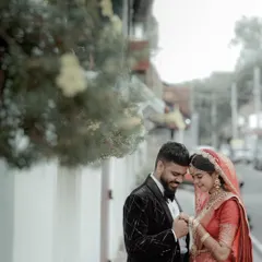 A quiet moment together amidst the wedding day buzz. This intimate portrait of a couple in their wedding attire shows the deep connection that is at the heart of the celebration.