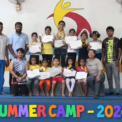 Our summer camp team. A group photo of our dedicated coaches and happy campers after a successful and rewarding program.