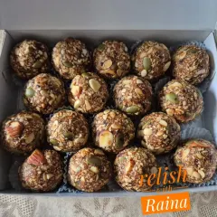 These are my Weight Loss Laddoos, also called Protein Laddoos. They are made with zero ghee and contain oats, peanuts, almonds, and a variety of seeds, all sweetened with dates for a low-calorie energy boost.