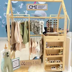 We built this house-shaped wooden stall for a children's clothing and accessories brand. The creative design helps the brand stand out and provides a playful theme that attracts families in a busy mall environment.