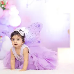 Capturing a real-life angel at her first birthday party. Milestone shoots for kids are all about capturing their curious and adorable expressions in a fun, relaxed setting.
