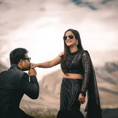 A chivalrous moment captured on the roads of Spiti. The dramatic clouds and mountains add a cinematic feel to this pre-wedding portrait.