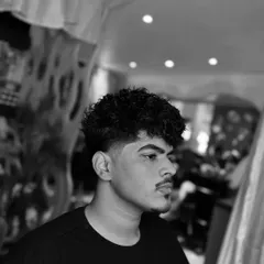 Hair perming is a great way to get a new look. This black and white shot shows the amazing texture you can get from a perm.