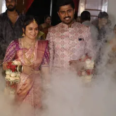 We help you make a grand entrance. Here, we coordinated a dramatic smoke effect for the couple's entry, adding a magical touch to their wedding reception and creating an unforgettable moment.