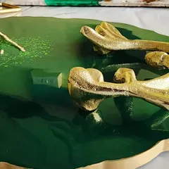 A resin platter and coaster set ready to ship. This emerald green set with golden deer handles is so elegant.