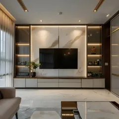 A sophisticated TV unit featuring a white marble backdrop and integrated side cabinets with glass doors. The warm backlighting in the shelves provides a beautiful glow, perfect for displaying decor.