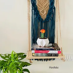 This wall shelf was a custom order. The client wanted a beautiful way to display her books and a small cactus. The deep teal and off-white combination looks so elegant.