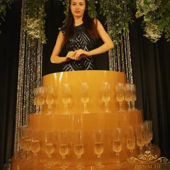 To add a touch of unique glamour to a cocktail party, we arranged for a champagne-serving artist. This interactive entertainment element is always a conversation starter and a delight for guests.