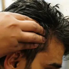 A soothing head massage is integral to my hair care philosophy. I focus on stimulating the scalp to improve circulation, which is essential for promoting healthy hair growth and relaxation.