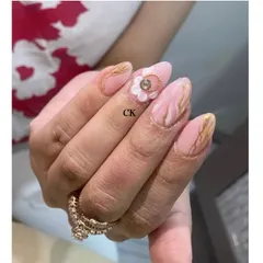 A truly luxurious design combining several techniques. I created a pink marble base with gold chrome veins and added a stunning 3D flower with a gold bead center.