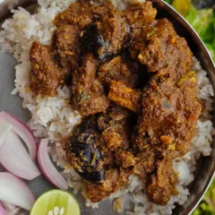 Konkani Mutton Kokum Masala over Indrayani rice. The masala and kokum are sourced directly from the Mapusa Market in Goa. It's a dish that brings the flavours of the Konkan coast to your plate.