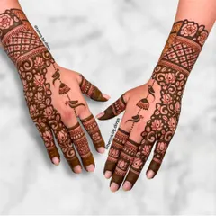 This intricate design combines lotus and rose florals with delicate jhumka and bird motifs. The detailed grid work on the cuff adds another layer of traditional beauty.