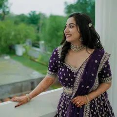 A solo portrait of the bride. Her makeup is modern and chic, with a subtle smokey eye and a beautiful nude lip.