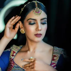 This portrait focuses on the makeup and traditional head jewelry (maang tikka). It showcases how we collaborate with makeup artists to complete the look.