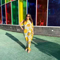 Soaking in the sun and the style at the Shivan and Narresh show in one of their printed kaftans. Couture season is my favorite time of year for its riot of color and creativity.