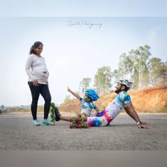 Our skating family is growing. A special moment from our maternity photoshoot, with our daughter pointing to the future, excited for her new partner in crime.
