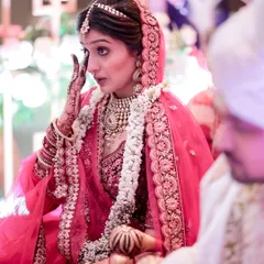A single tear holds a thousand emotions. This candid shot captures the bride in a moment of overwhelming feeling during her wedding ceremony, a beautiful and honest expression of the day's significance.