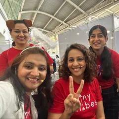 A happy selfie of our team backstage at the Kukdukoo Fest. We are all smiles after a successful performance, wearing our matching red Tiny Tribes shirts and fun character headbands. This is our tribe, full of passion and joy.