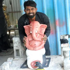 Here I am with a finished Ganesha sculpture, my first friend in art. This piece, from its peaceful, meditative expression to the little mouse at his feet, is ready to bring blessings to a new home.