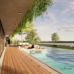 This waterfront residence is designed to dissolve the boundaries between the home and the Gurupura river. A handcrafted wooden deck and an infinity pool create a continuous plane of water and wood, offering a tranquil space for relaxation and social gatherings.